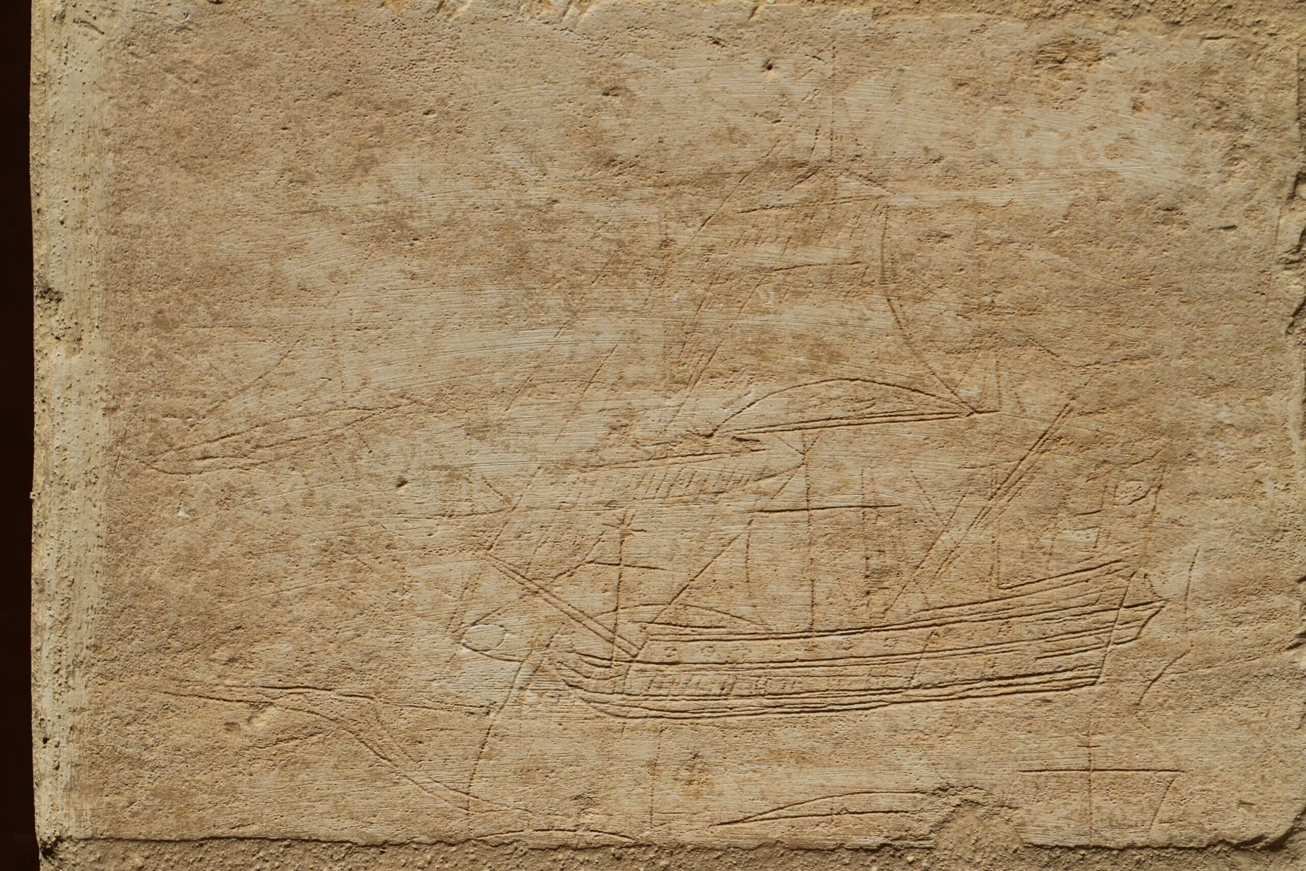 The ship graffito is detailed and realistic. This example is superimposing another ship graffito.
